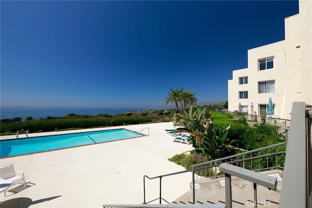 view of swimming pool featuring a patio area