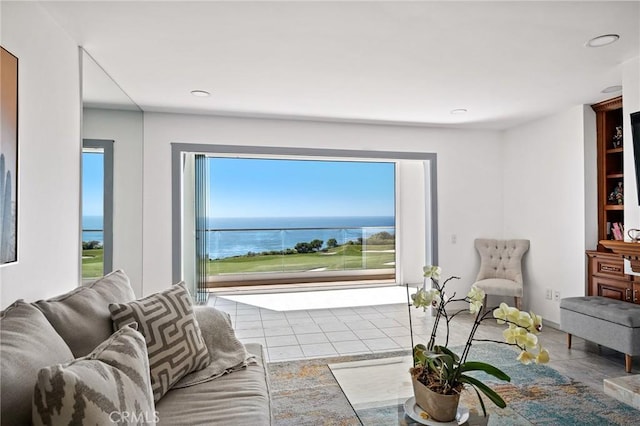 living room featuring a water view and plenty of natural light