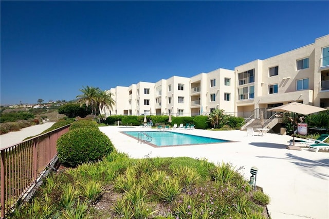 view of swimming pool featuring a patio area