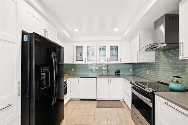 kitchen featuring black fridge, stainless steel range with electric cooktop, white cabinetry, and dishwasher