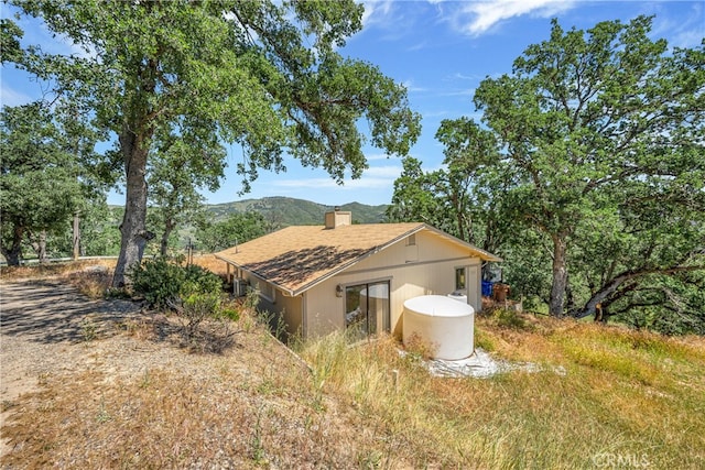 view of home's exterior with a mountain view