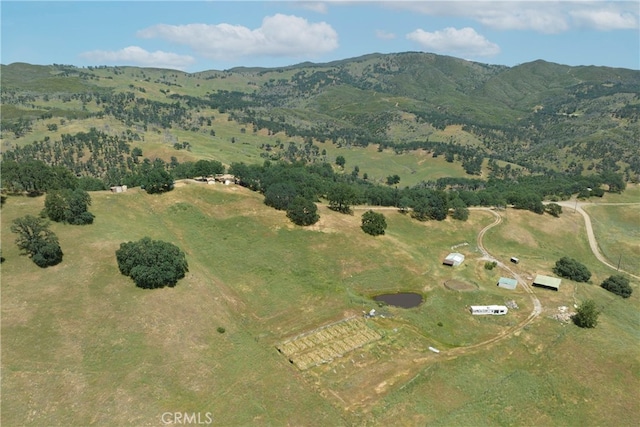 birds eye view of property featuring a mountain view and a rural view