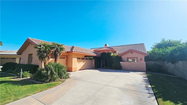 mediterranean / spanish house with a garage