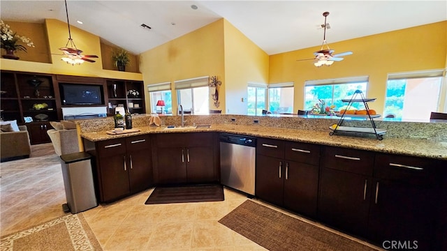 kitchen with light tile flooring, light stone countertops, ceiling fan, and dishwasher