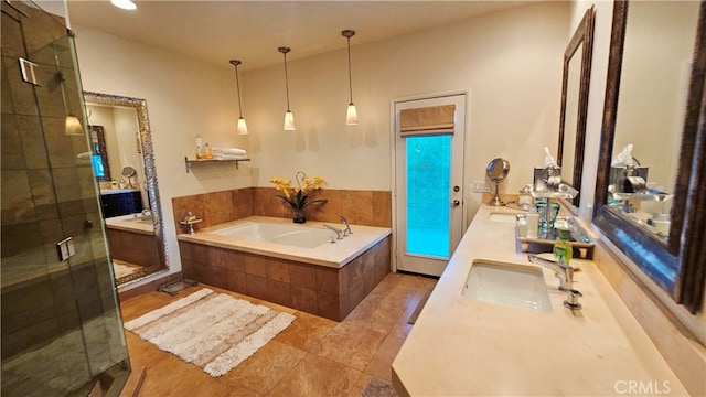 bathroom featuring tile flooring, plus walk in shower, and vanity