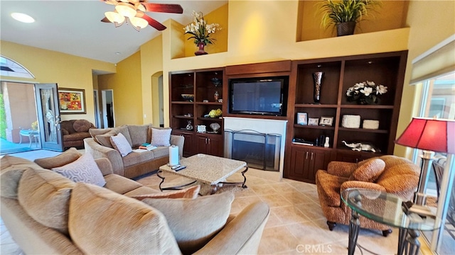 living room with ceiling fan, light tile floors, and high vaulted ceiling