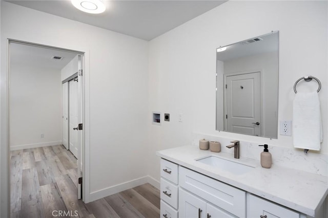 bathroom featuring hardwood / wood-style floors and vanity