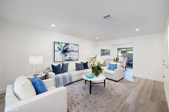 living room with light hardwood / wood-style floors