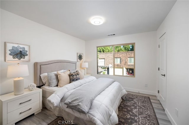 bedroom with light hardwood / wood-style floors