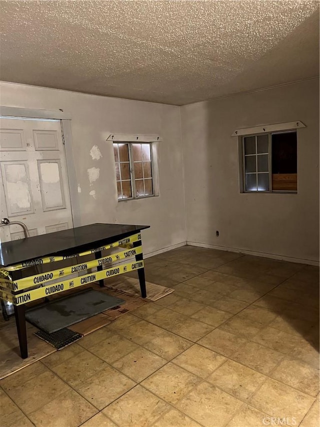 foyer with a textured ceiling