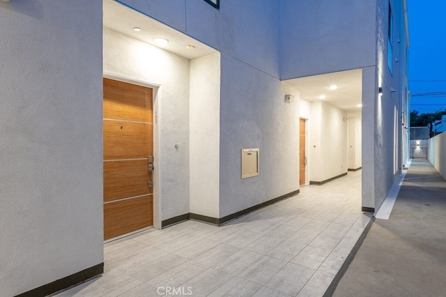 hallway featuring a high ceiling