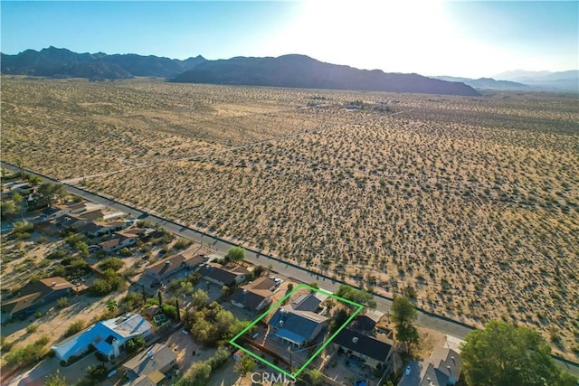 birds eye view of property featuring a mountain view