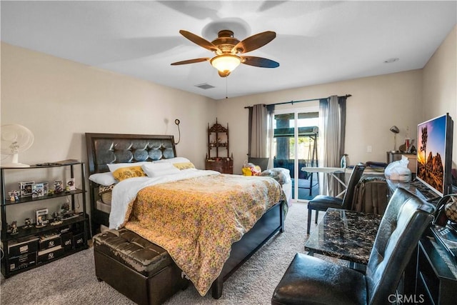 carpeted bedroom with ceiling fan and access to outside