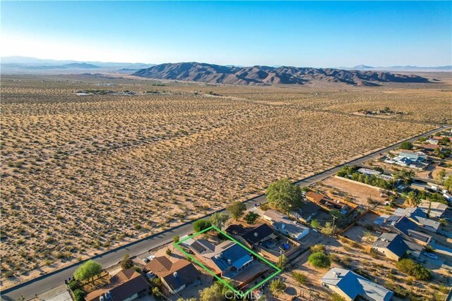 birds eye view of property featuring a mountain view