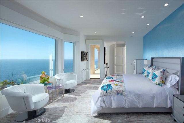 bedroom featuring a water view