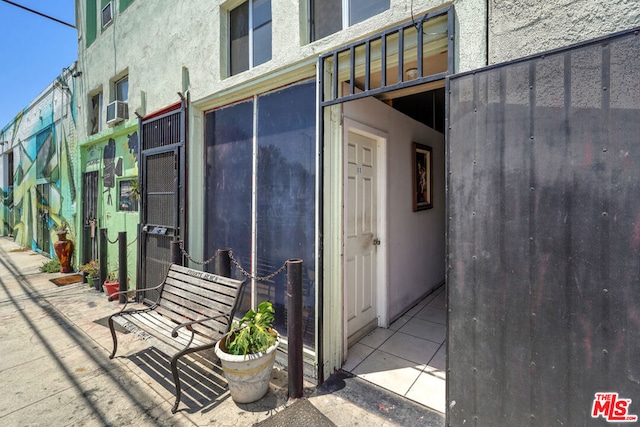 doorway to property with central AC unit