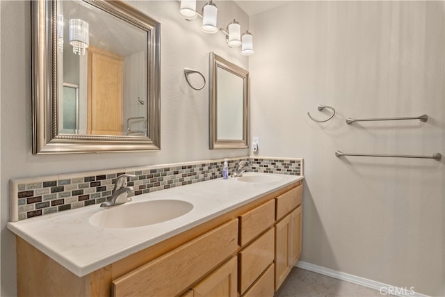 bathroom featuring backsplash and dual bowl vanity