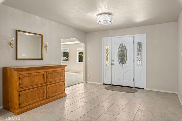 foyer entrance featuring light tile floors