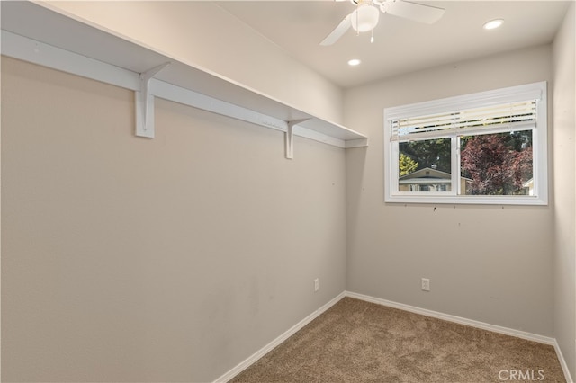 interior space with ceiling fan