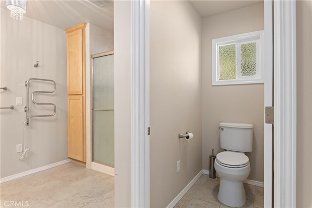 bathroom featuring tile floors and toilet