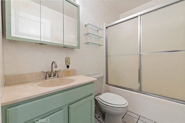 full bathroom featuring shower / bath combination with glass door, toilet, tile floors, and vanity