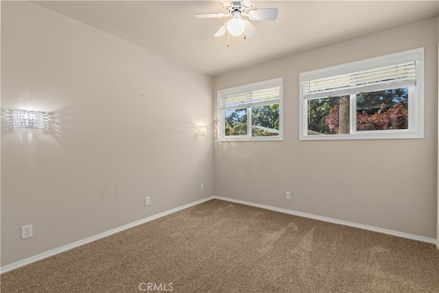 carpeted empty room with ceiling fan