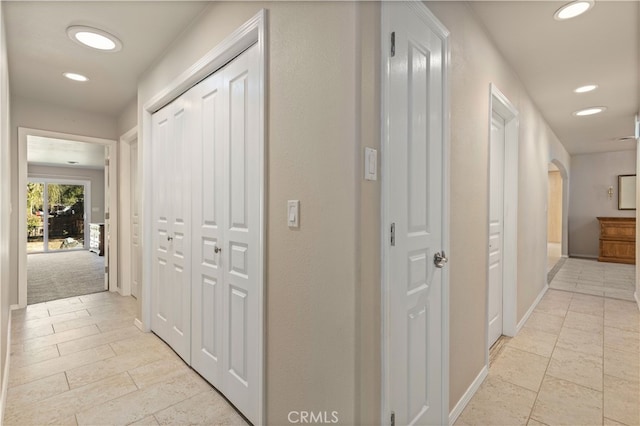 hallway with light tile floors