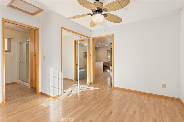 unfurnished room featuring light hardwood / wood-style floors and ceiling fan