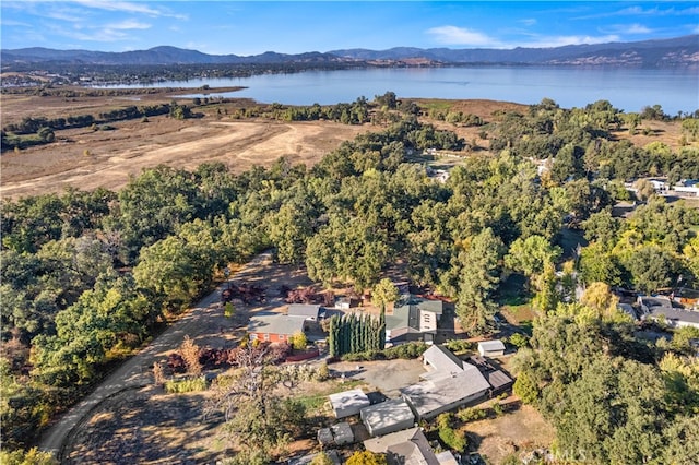 bird's eye view with a water and mountain view