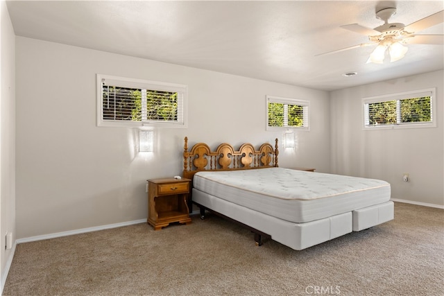 bedroom with light carpet and ceiling fan