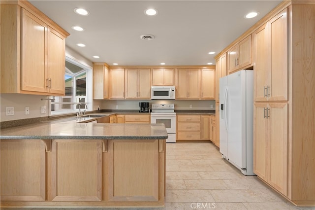 kitchen with kitchen peninsula, white appliances, light brown cabinetry, and light tile flooring