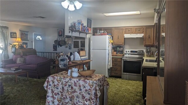 kitchen featuring electric stove, dark colored carpet, sink, and white refrigerator