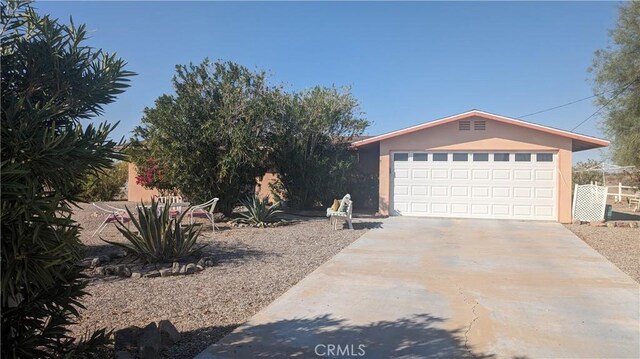 ranch-style house featuring a garage