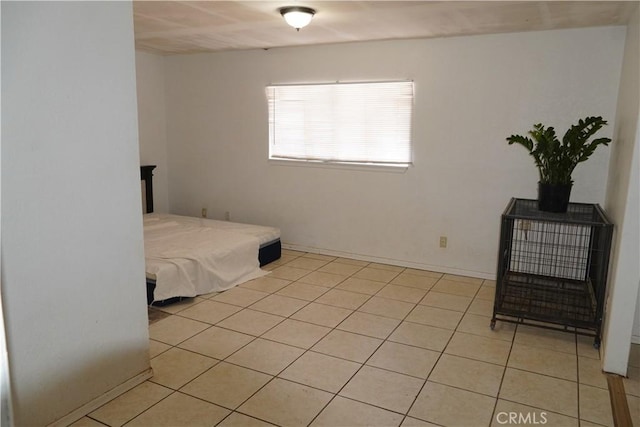 bedroom featuring light tile patterned floors