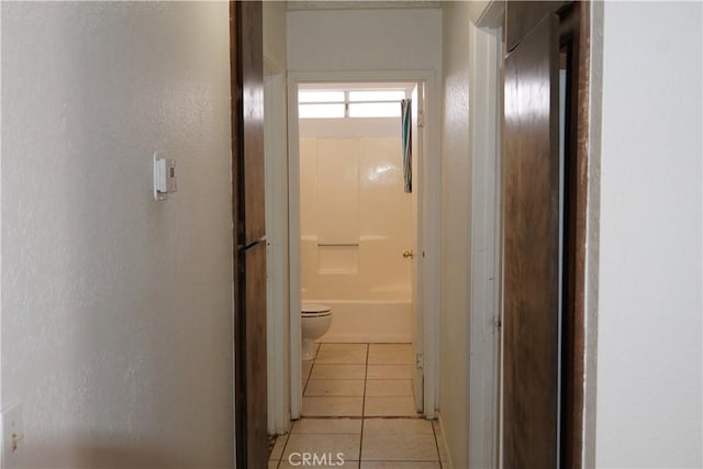 hallway with light tile patterned floors