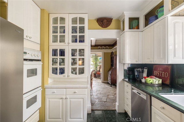 kitchen with white cabinetry and stainless steel appliances