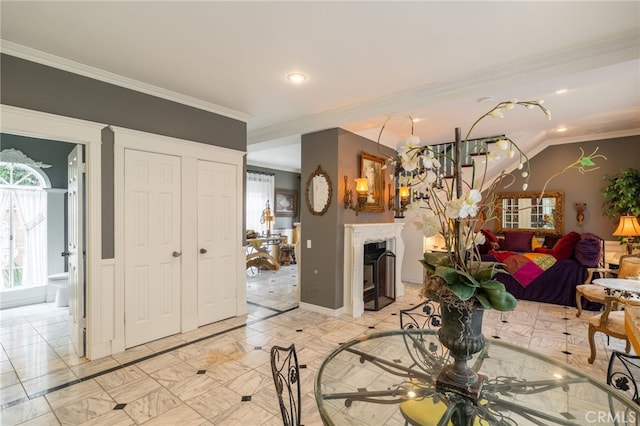 dining space with crown molding