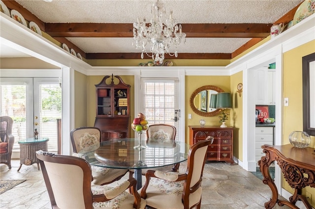 dining space with french doors, beamed ceiling, a chandelier, and a textured ceiling