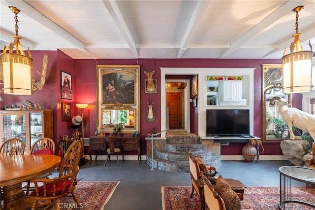 living room with beamed ceiling