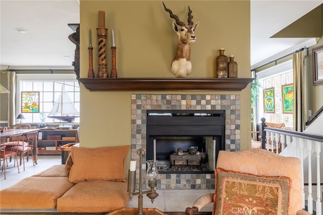 interior space with a healthy amount of sunlight and a tile fireplace