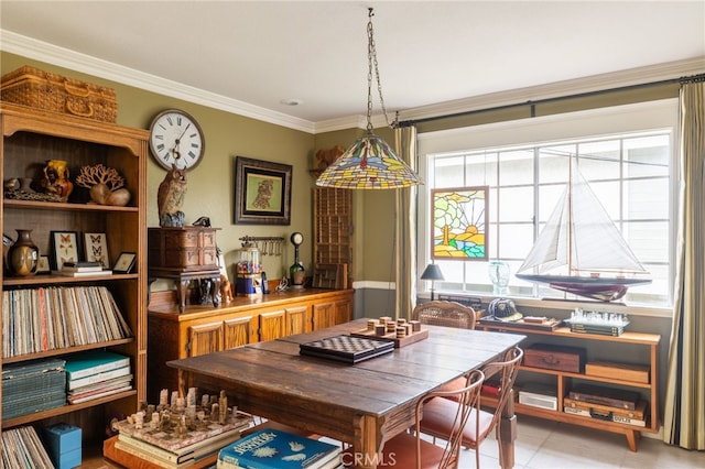 dining room featuring light tile patterned floors and crown molding