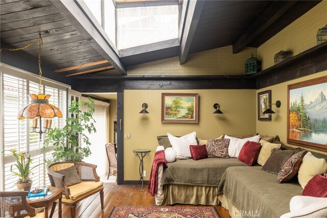 bedroom featuring light wood-type flooring, brick wall, wood ceiling, and beamed ceiling