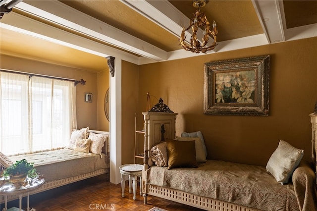 living area featuring dark parquet flooring, a notable chandelier, and beamed ceiling