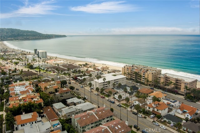 aerial view with a water view and a view of the beach