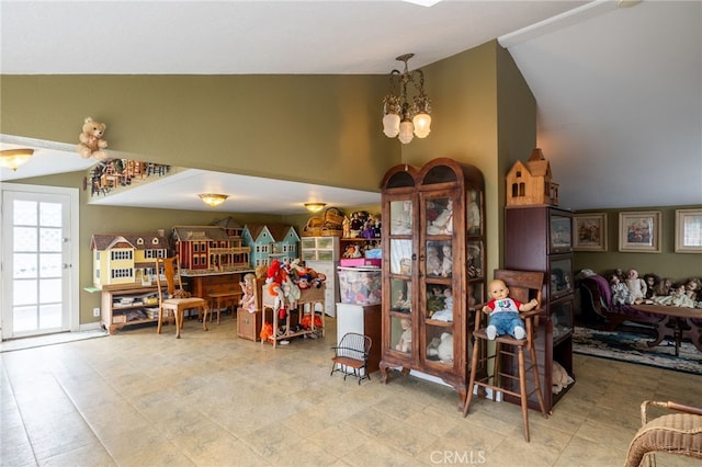 interior space with lofted ceiling and a chandelier