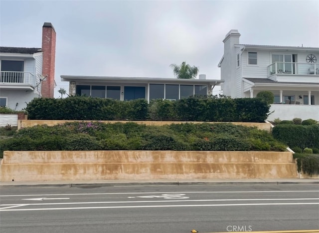 view of front of home with a balcony