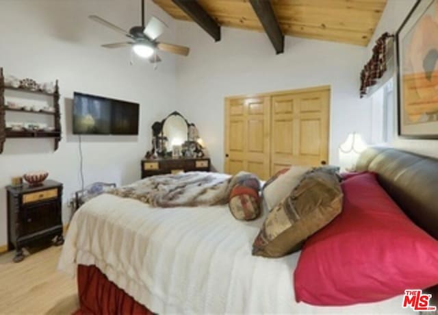 bedroom with vaulted ceiling with beams, light hardwood / wood-style floors, wood ceiling, and ceiling fan