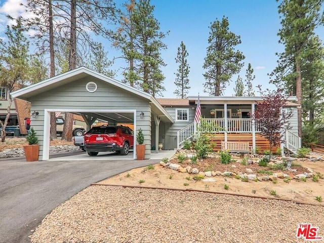 ranch-style house with covered porch and a garage