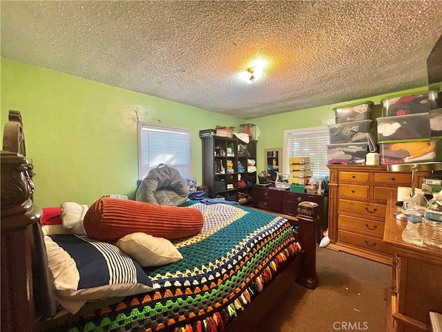 carpeted bedroom featuring a textured ceiling