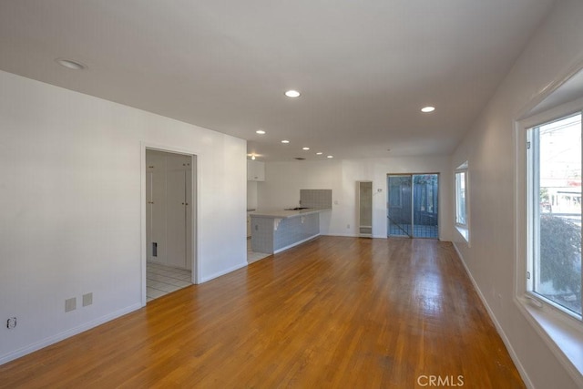 unfurnished living room featuring light hardwood / wood-style floors